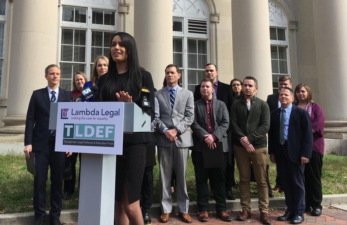 FILE - Lambda Legal lawyer Taylor Brown addresses reporters on March 11, 2019, in Durham, N.C., to announce a lawsuit arguing that North Carolina's health plan for state employees discriminates by not covering hormone treatment and surgery for transgender people. The state employee health plan will resume coverage of gender affirming treatments for transgender employees, the state treasurer said Wednesday, July 13, 2022, complying with a June federal court ruling that declared the refusal of coverage unconstitutional. (AP Photo/ Jonathan Drew, File)