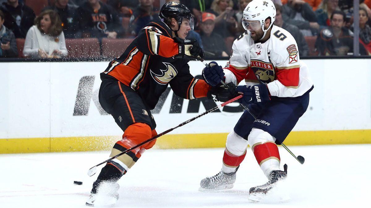 The Ducks' Hampus Lindholm (47) defends a play to the net by the Panthers' Aaron Ekblad during the second period on Nov. 19.