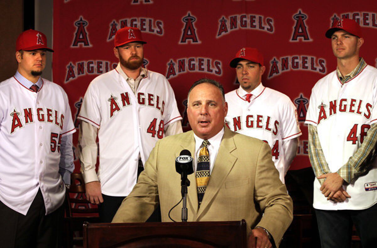 Angels Manager Mike Scioscia introduces pitchers (from left) Joe Blanton, Tommy Hanson, Sean Burnett and Ryan Madson last fall.
