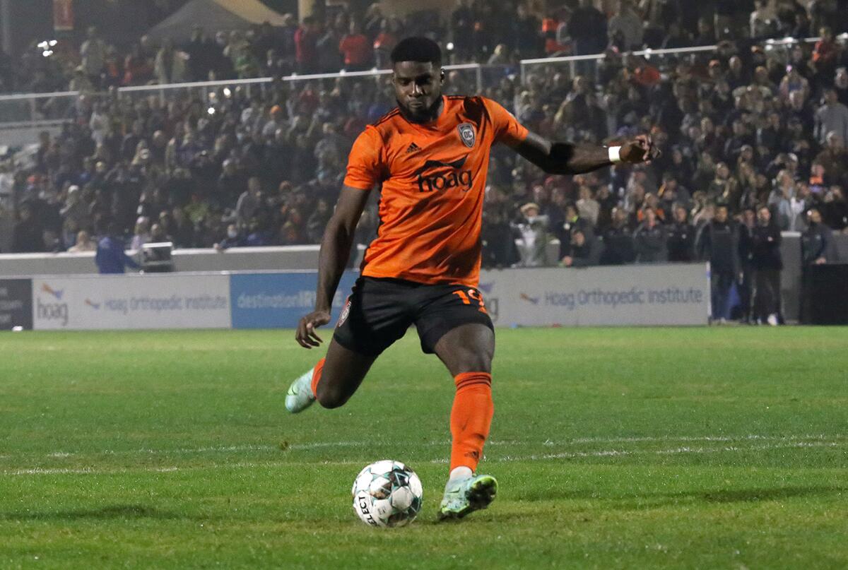 Orange County Soccer Club's Sean Okoli takes a penalty kick against San Antonio FC in the Western Conference finals.