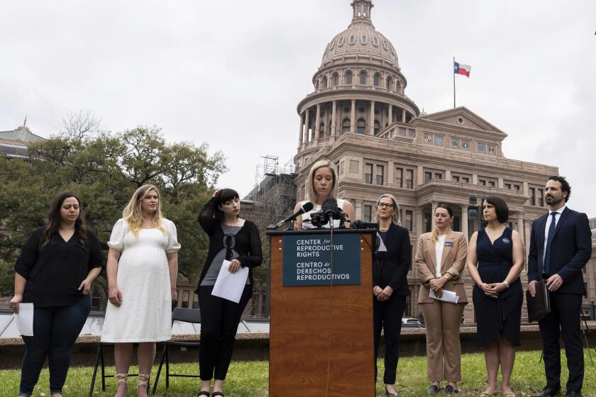 FILE - Amanda Zurawski, one of five plaintiffs, speaks in front of the state Capitol in Austin, Texas, March 7, 2023, as the Center for Reproductive Rights and the plaintiffs announced their lawsuit, which asks for clarity in Texas law as to when abortions can be provided under the "medical emergency" exception. All five women were denied medical care while experiencing pregnancy complications that threatened their health and lives. The women are headed to court Wednesday, July 19, as legal challenges to abortion bans across the U.S. continue a year after the fall of Roe v. Wade. (Sara Diggins/Austin American-Statesman via AP, File)
