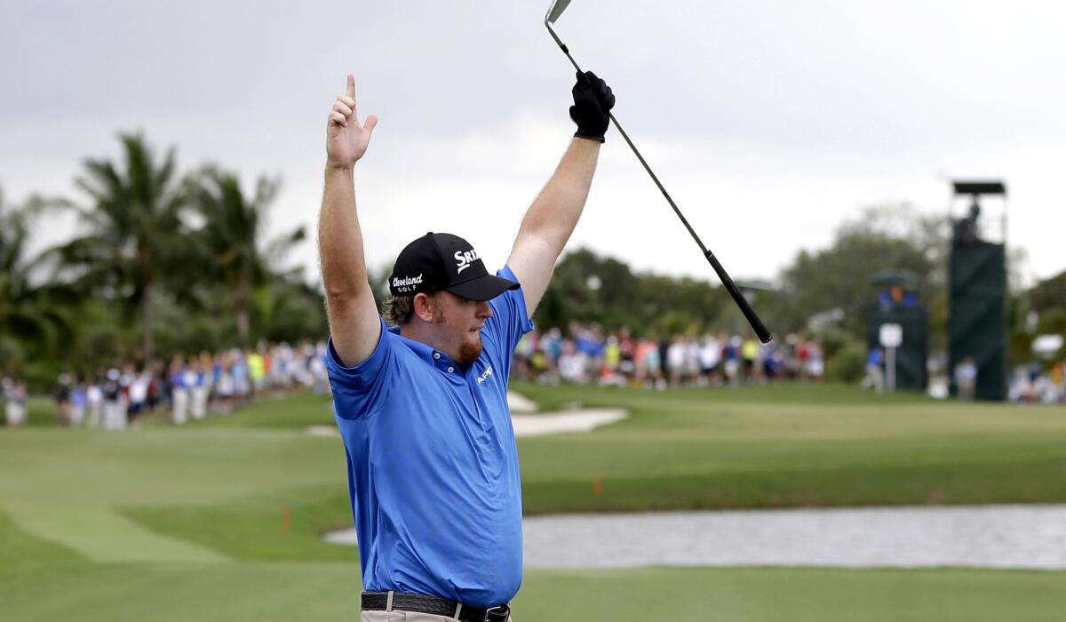 J. B. Holmes celebrates a hole-in-one on the fourth tee during the third round of the WGC Cadillac Championship on Saturday.