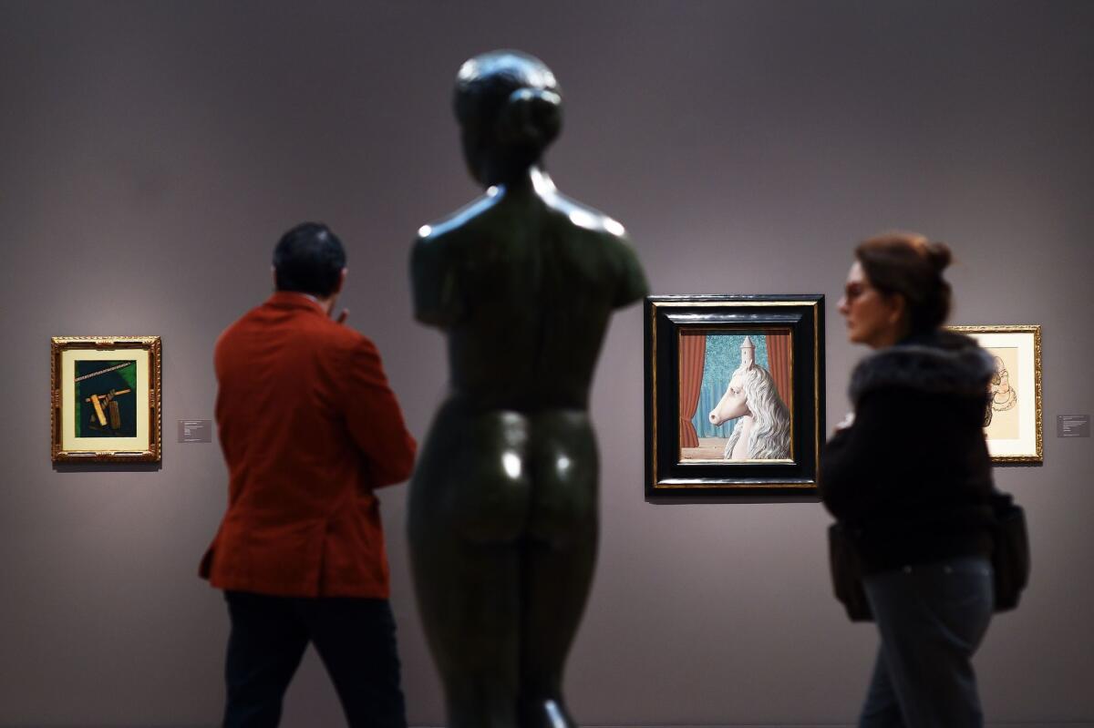 Visitors look at artwork during an October media preview at Sotheby's New York.