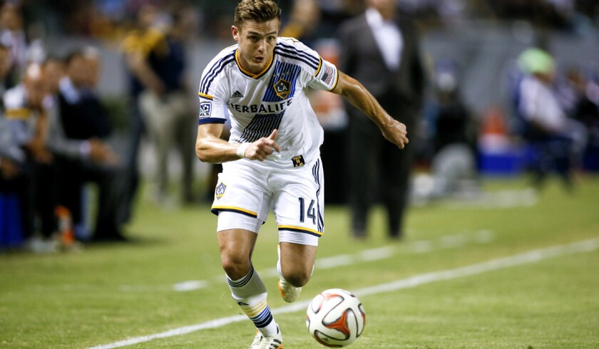 Robbie Rogers brings the ball up field for the Galaxy during a 4-1 victory over D.C. United earlier this season at StubHub Center.