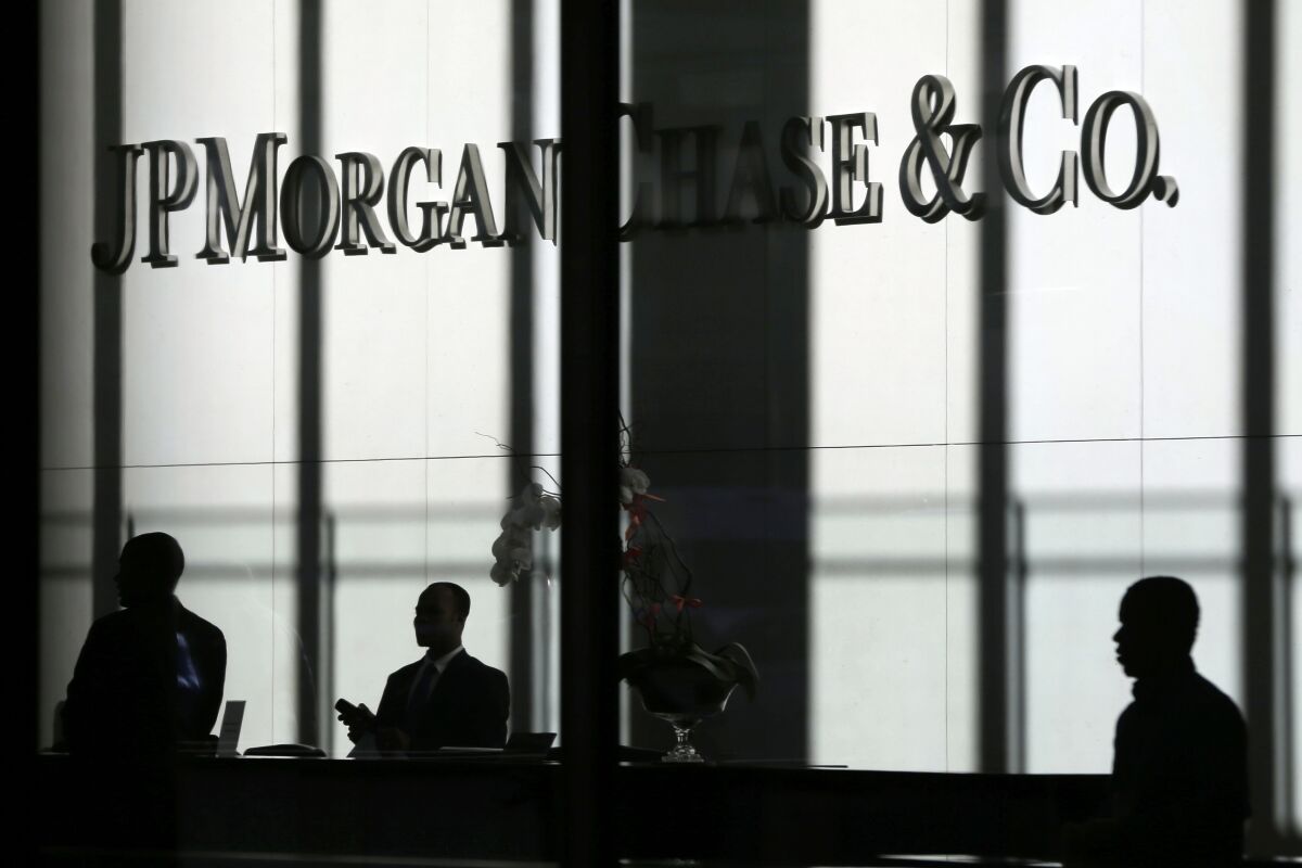FILE - The JPMorgan Chase & Co. logo is displayed at their headquarters in New York on Oct. 21, 2013. You'll no longer be able to store your precious coins, jewelry and paperwork at JPMorgan Chase & Co., as the bank has stopped opening new safety deposit boxes for customers. A spokesman for the bank said Chase decided late last year to stop offering new deposit boxes to customers as a “business decision” but declined to share specifics. (AP Photo/Seth Wenig, File)