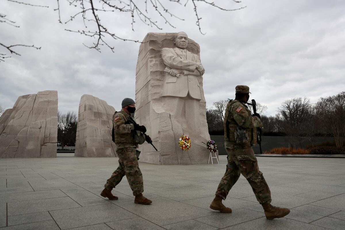 National Guard troops patrol the National Mall near the Martin Luther King Jr. Memorial on Jan. 17. 