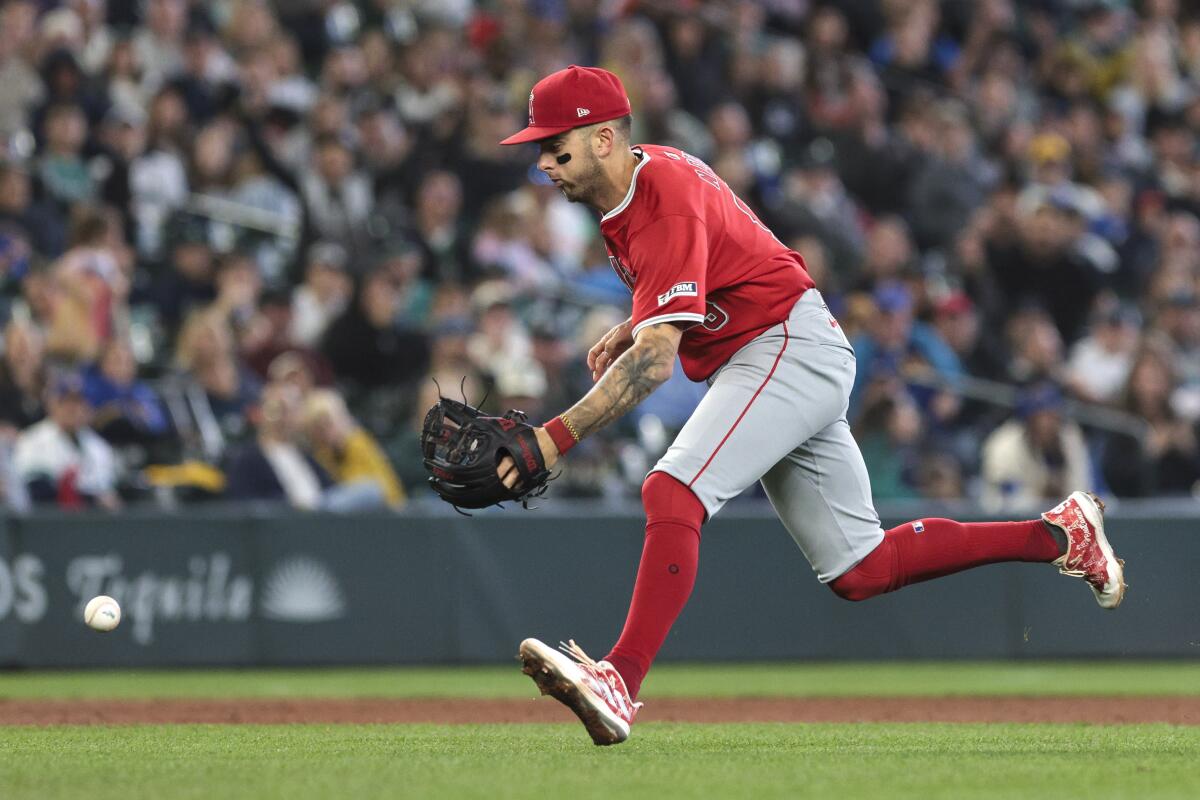 Angels shortstop Zach Neto mishandles the ball and is charged with an error against the Mariners.