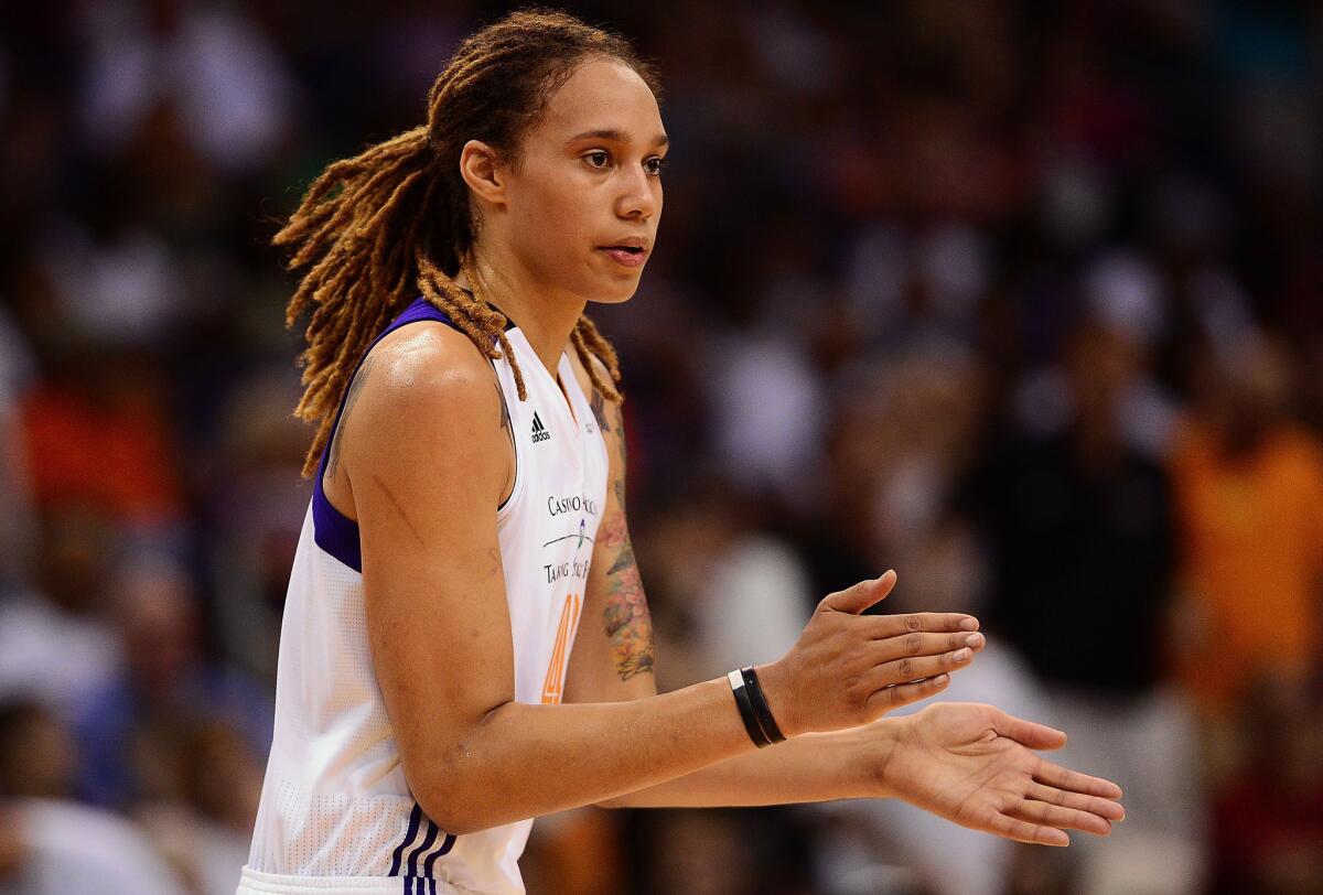WNBA star Brittney Griner claps her hands during a WNBA Finals game against the Chicago Sky.
