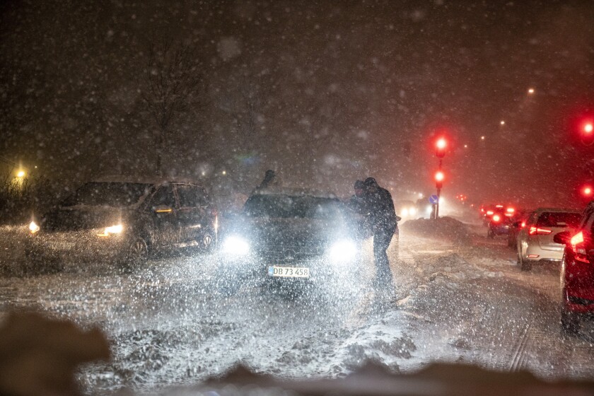 A snowstorm causes chaos on the roads around Aalborg, Denmark, Wednesday Dec. 1, 2021. (Henning Bagger/Ritzau Scanpix via AP)