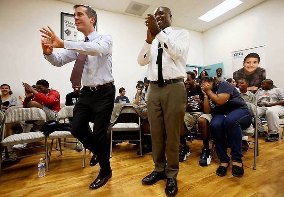 Los Angeles Mayor Eric Garcetti concludes a meeting with young residents of South Los Angeles on Tuesday.