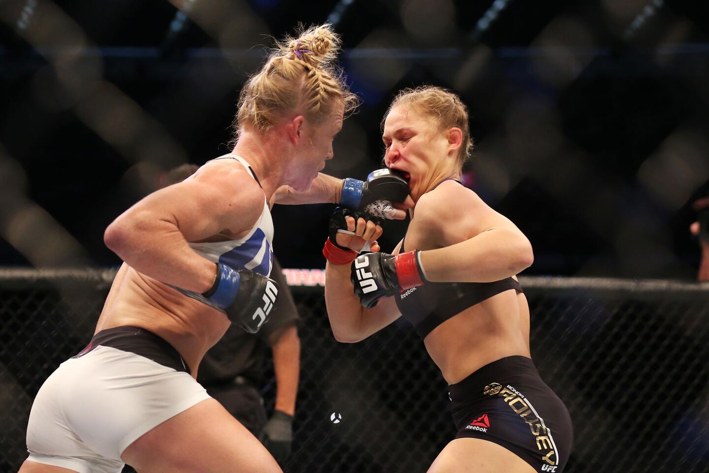 Ronda Rousey of the United States (R) and Holly Holm of the United States compete in their UFC women's bantamweight championship bout during the UFC 193 event at Etihad Stadium on November 15, 2015 in Melbourne, Australia.