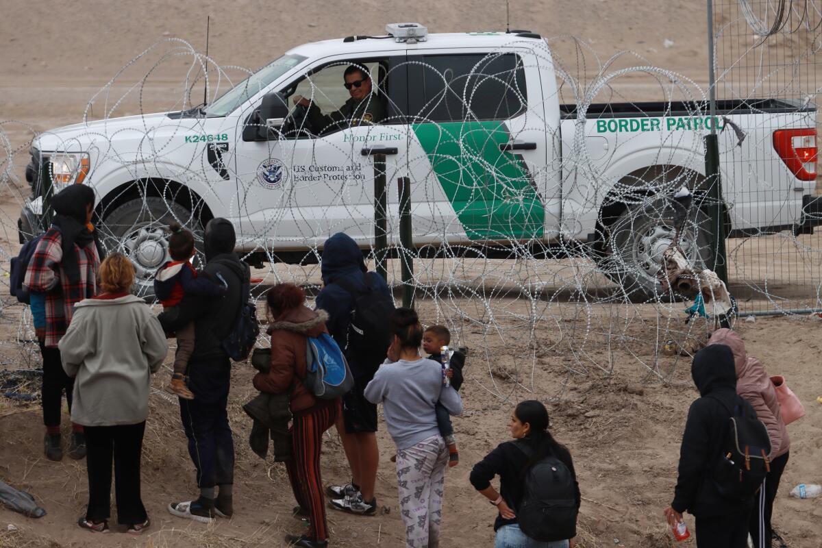 Migrants crossing the border into the U.S. from Ciudad Juarez, Mexico.