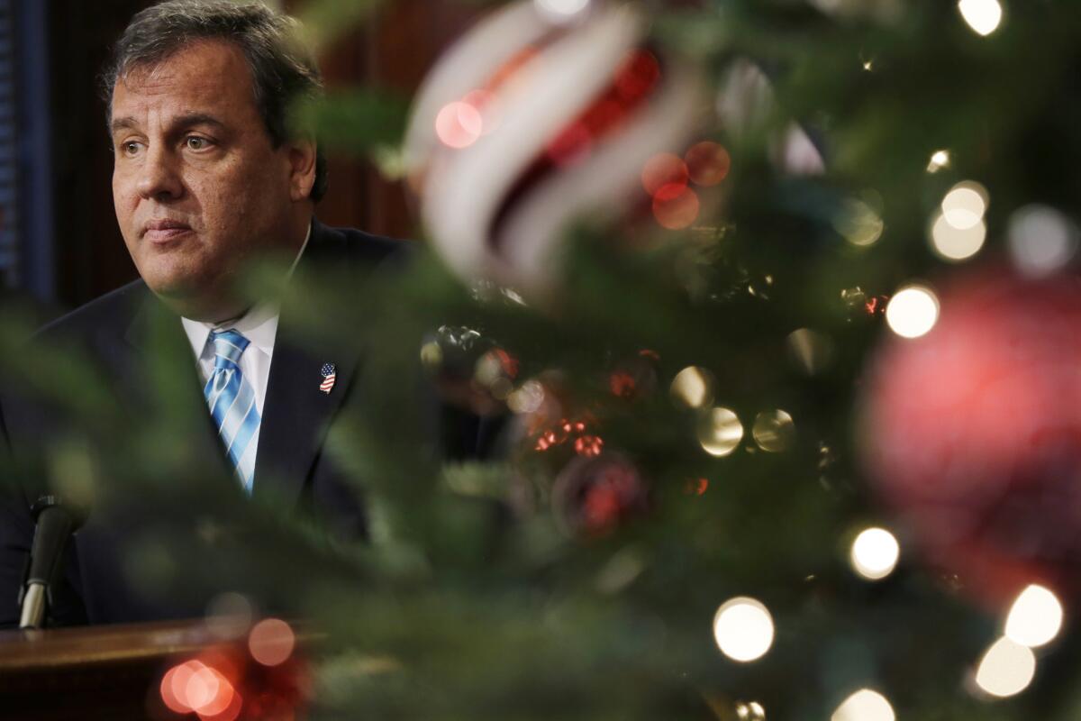 New Jersey Gov. Chris Christie, shown at a news conference this week, signed a bill Friday extending eligibility for in-state tuition rates to people brought into the country illegally as children.