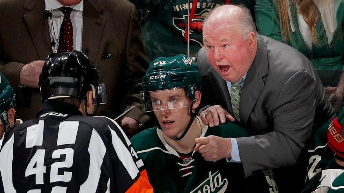 Minnesota Wild Coach Bruce Boudreau discusses a no goal with referee Jake Brenk during the third period of a game against the Blues on Dec. 11.