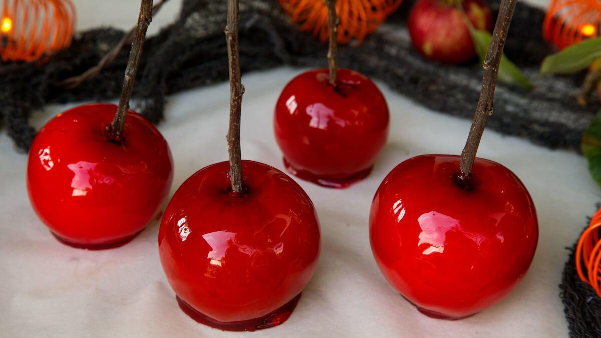 Candied apples: Apples coated with cooked sugar, flavoring and a little food coloring.