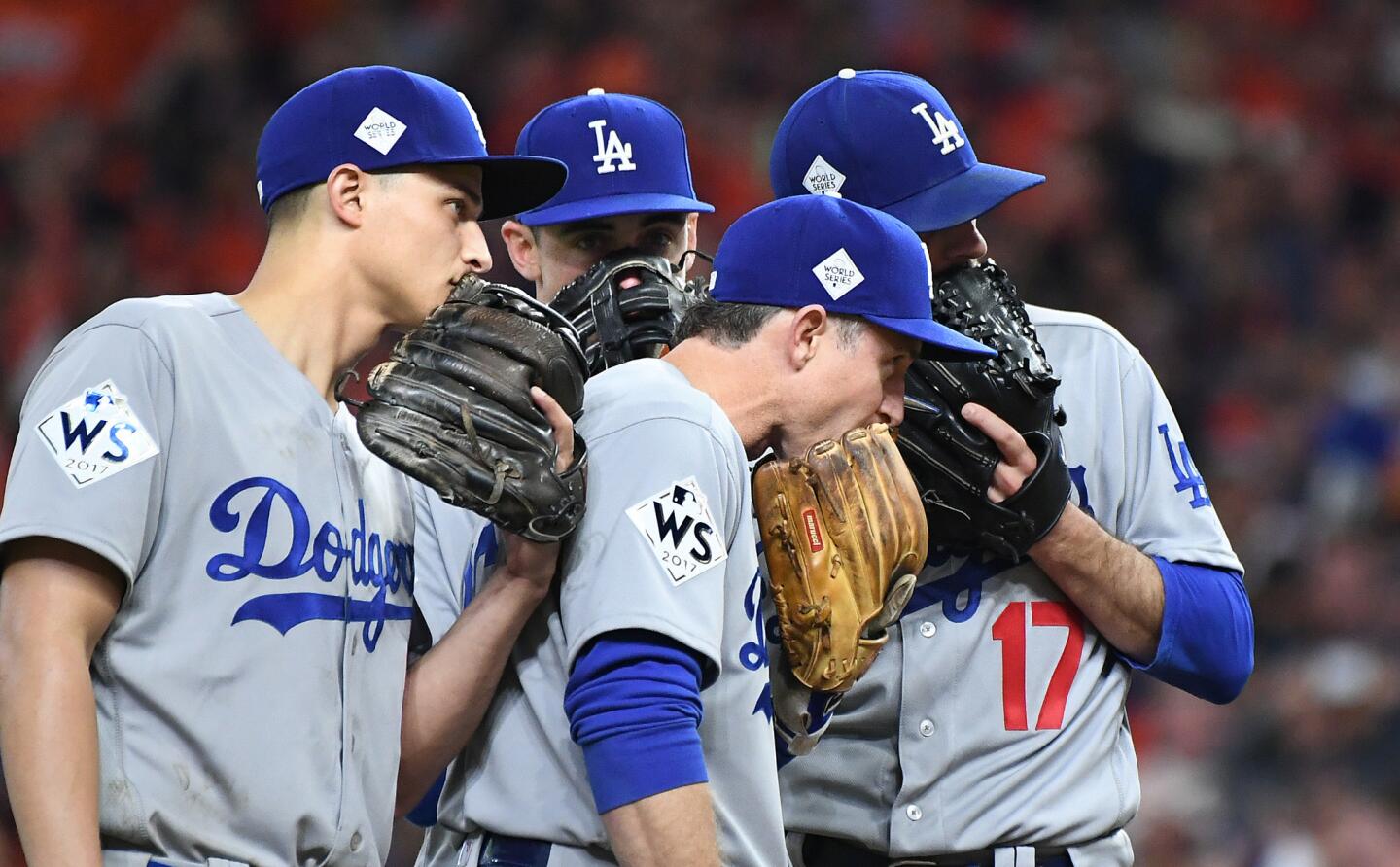 Dodgers' from left, Corey Seager, Cody Bellinger, Chase Utley and Brandon Morrow meet on the mound in Game 3.