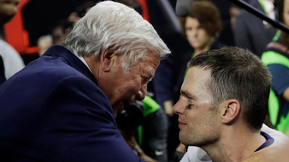 New England owner Robert Kraft and quarterback Tom Brady meet after the Patriots' victory over the Atlanta Falcons in Super Bowl LI.