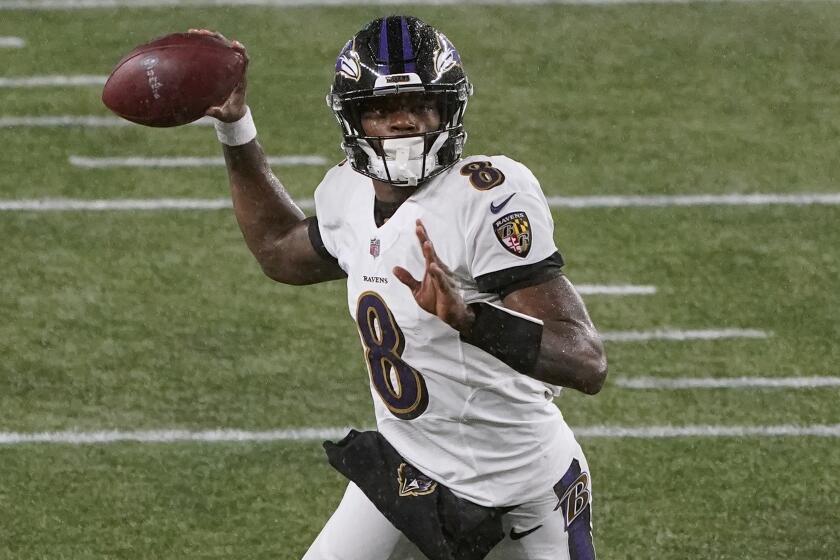 Baltimore Ravens quarterback Lamar Jackson passes the ball during an NFL football game against the New England Patriots, Sunday, Nov. 15, 2020, in Foxborough, Mass. (AP Photo/Charles Krupa)