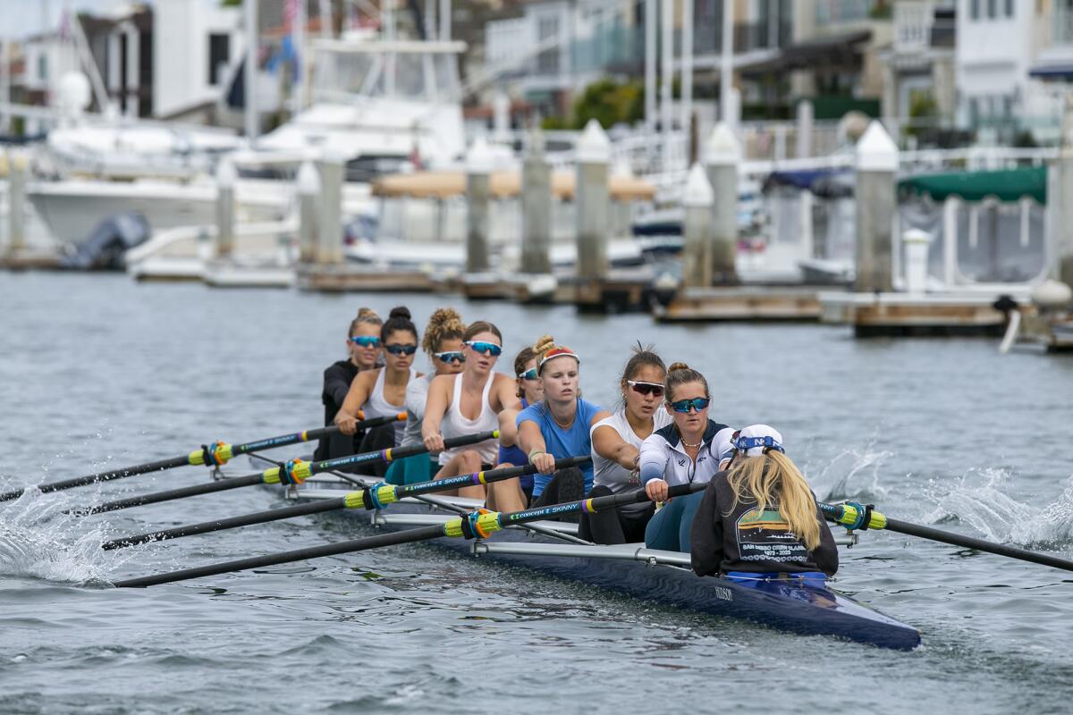 The Newport Aquatic Center varsity eight lead their team on a practice on Wednesday in the Newport Bay.