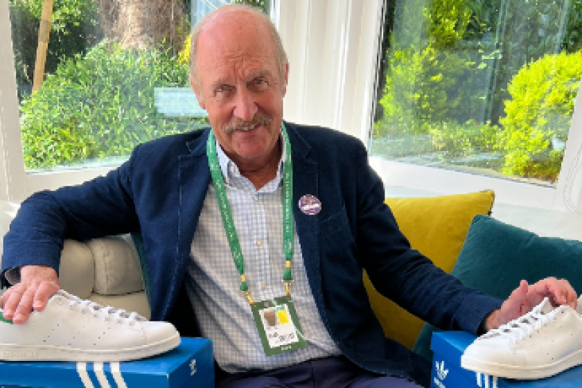Former Wimbledon champion Stan Smith poses with his signature Addias shoes in 2022