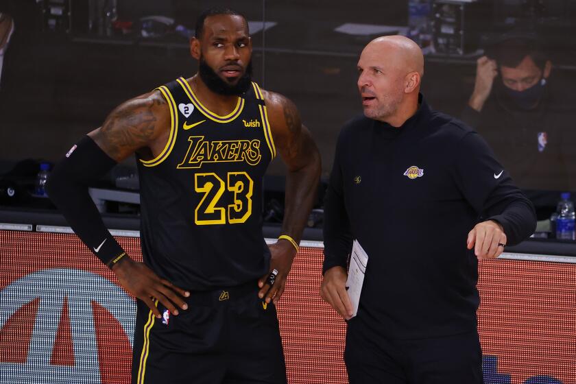 Los Angeles Lakers' LeBron James (23) talks with Jason Kidd in Game 4 of an NBA basketball first-round playoff series against the Portland Trail Blazers, Monday, Aug. 24, 2020, in Lake Buena Vista, Fla. (Kevin C. Cox/Pool Photo via AP)