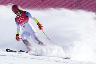 Mikaela Shiffrin of United States looks down after skiing off course during the first run of the women's giant slalom at the 2022 Winter Olympics, Monday, Feb. 7, 2022, in the Yanqing district of Beijing. (AP Photo/Robert F. Bukaty)