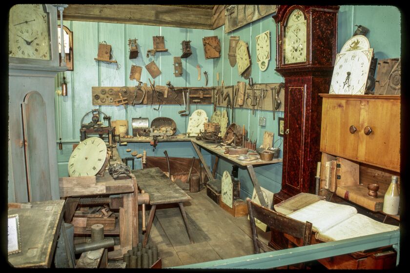 If only time could tell: Various pieces of clocks and clock mechanisms hang on the walls and sit on the worktables in a display at the American Clock & Watch Museum. Bristol was a major clock and watch producer. The museum displays 1,800 clocks and watches.