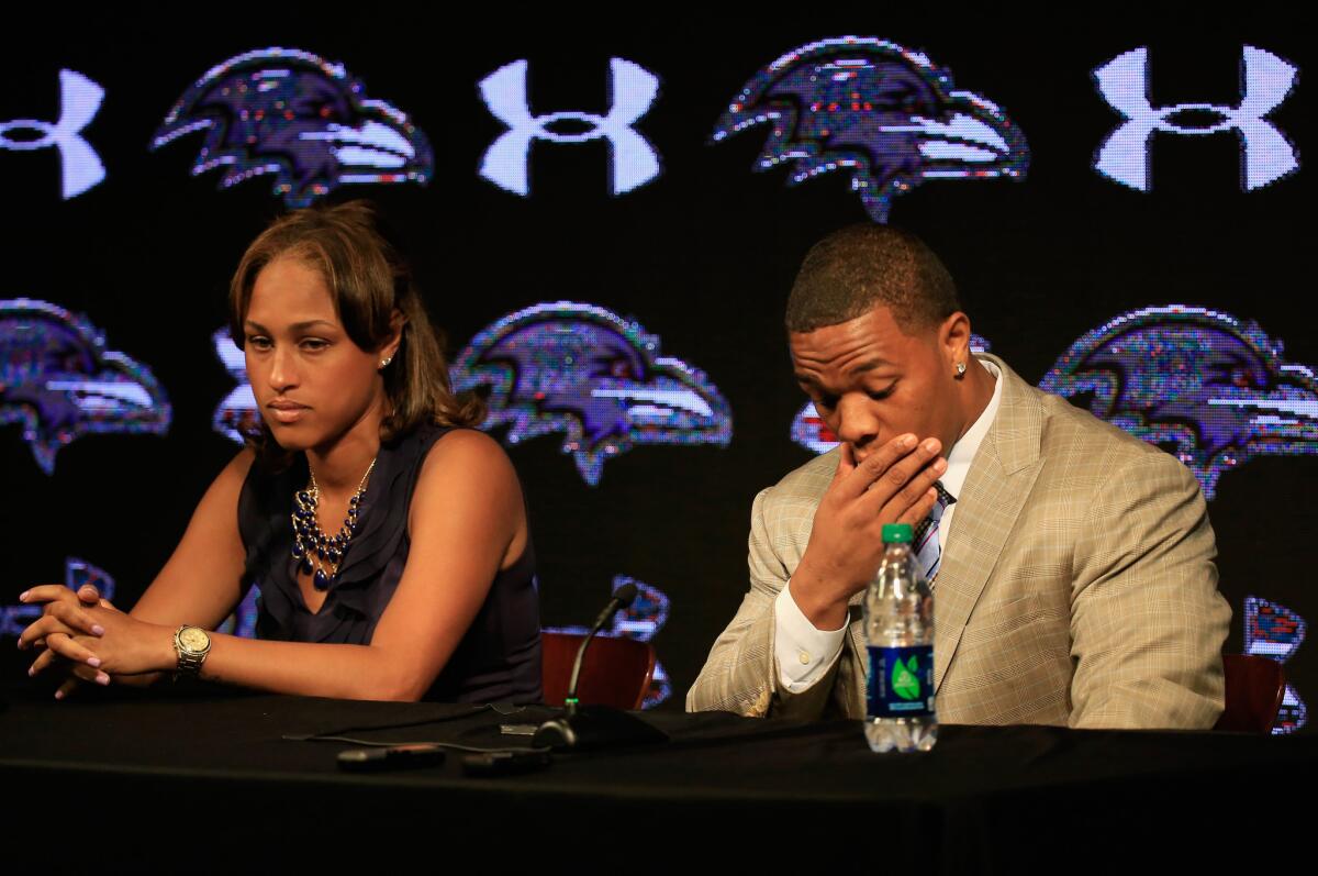 Running back Ray Rice and his wife, Janay, speak to the media in May. Rice's case has prompted Cover Girl ads to be altered by those protesting a line of NFL-related products.