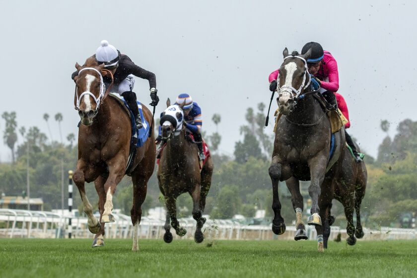 In a photo provided by Benoit Photo, The Chosen Vron and jockey Hector I. Berrios, left, battle Indian Peak, with Juan Hernadez, as The Chosen Vron goes on to win the $100,000 Sensational Star Stakes horse race Sunday, March 19, 2023, at Santa Anita in Arcadia, Calif. (Benoit Photo via AP)