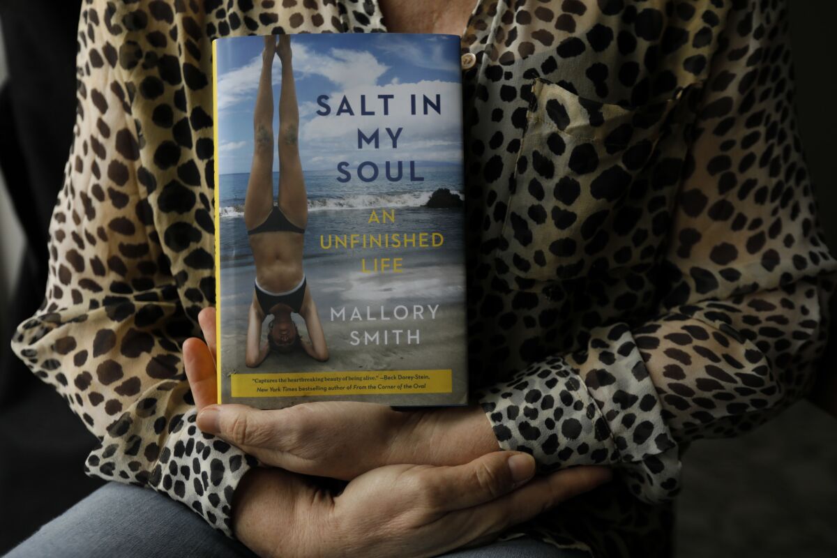 Diane Shader Smith holds her daughters memoir.
