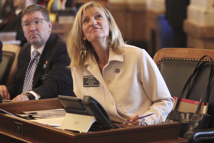 Kansas House Judiciary Committee Chair Susan Humphries, R-Wichita, watches an electronic tally vote as the House approves a bill requiring pornography websites to verify the ages of their Kansas visitors, Tuesday, March 26, 2024, at the Statehouse in Topeka, Kan. The measure is likely to be come law and have Kansas joining at least eight other states in requiring age verification. (AP Photo/John Hanna)