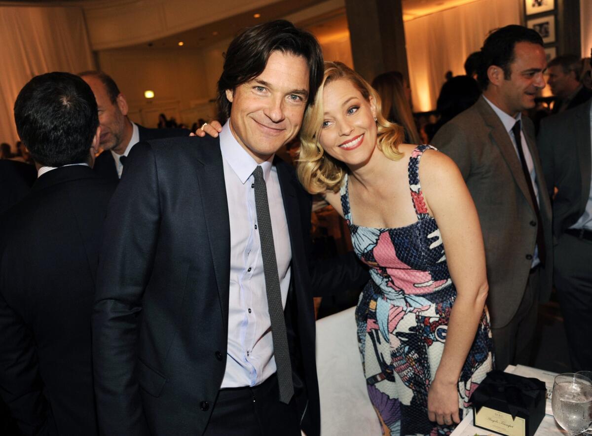 Host Jason Bateman, left, poses with Grace Kelly Award honoree Elizabeth Banks during the 2014 March of Dimes Celebration of Babies at the Beverly Wilshire Hotel on Friday.