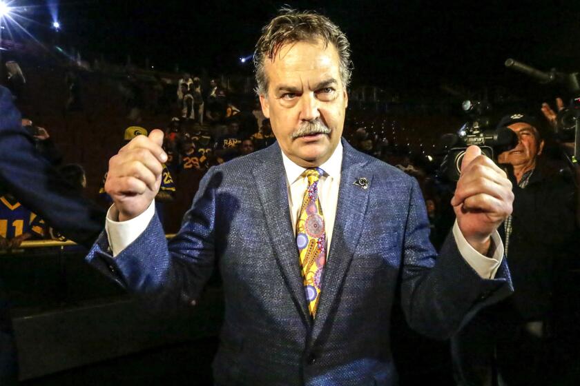 Rams Coach Jeff Fisher takes part in the news conference at the Forum in Inglewood on Friday.