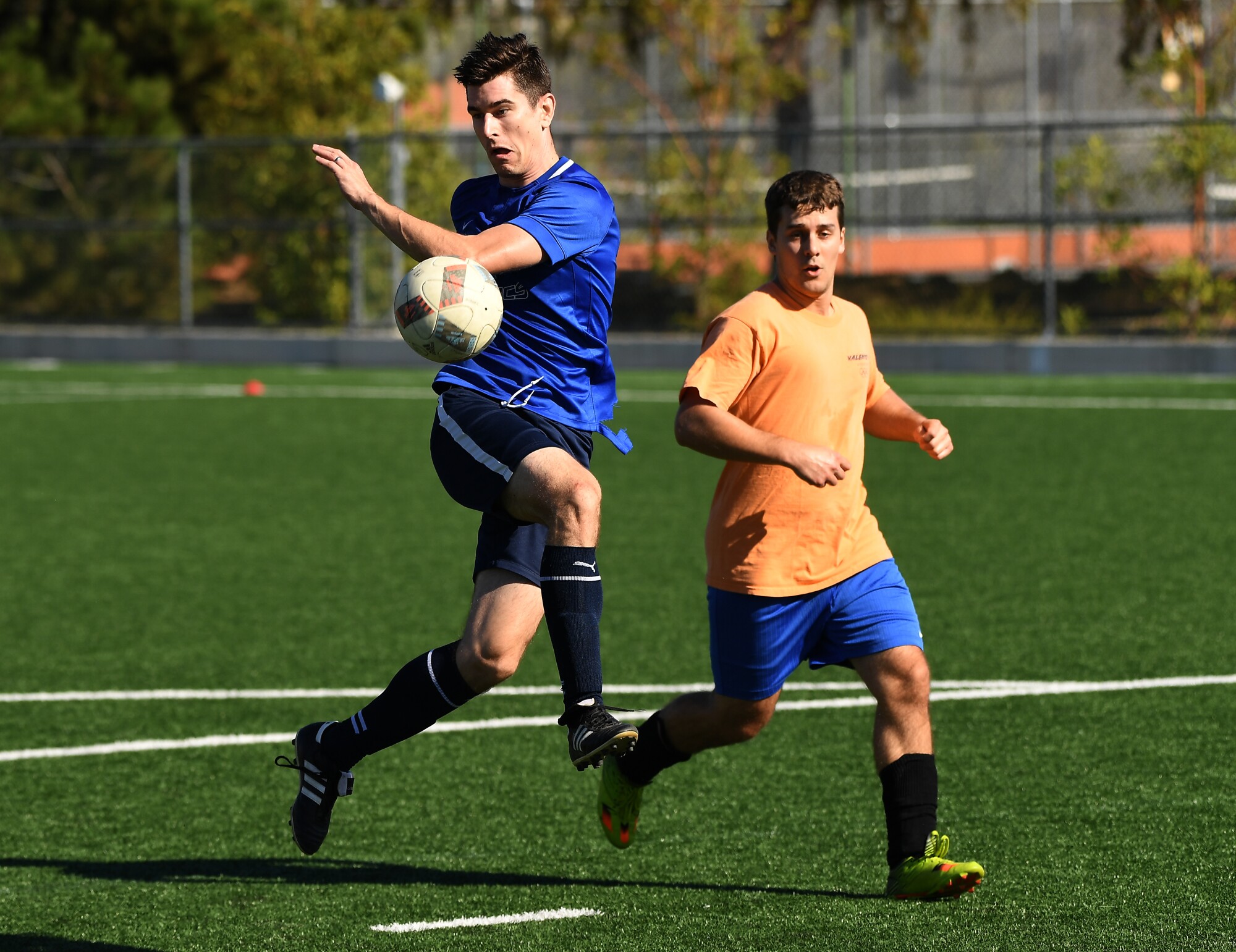 Matthew Schwab, left, takes a shot on goal during a Nerd Soccer League game at Caltech in Pasadena.