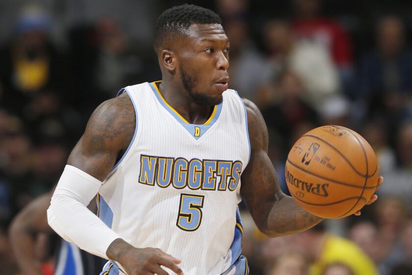 Denver Nuggets guard Nate Robinson dribbles the ball during a game against the Orlando Magic on Jan. 7. Robinson will make his debut with the Clippers against the Golden State Warriors on Sunday.