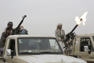 A Houthi fighter fires in the air during a gathering in Sanaa, Yemen, in 2018.