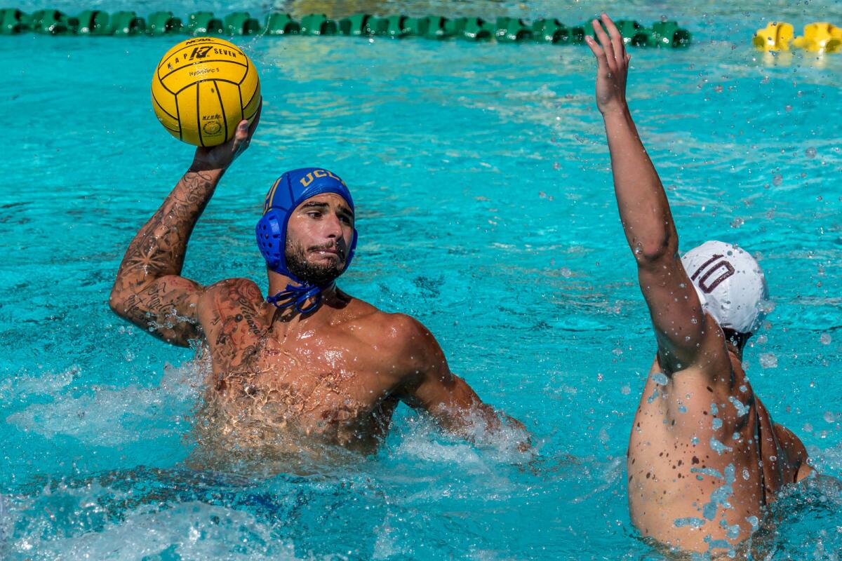 UCLA senior Nicolas Saveljic lines up a shot during the NCAA men's water polo championships against USC. 
