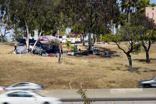 Chula Vista, CA - May 21: An encampment near the Palomar Street offramp on northbound Int 5 in Chula Vista, CA. (Nelvin C. Cepeda / The San Diego Union-Tribune)