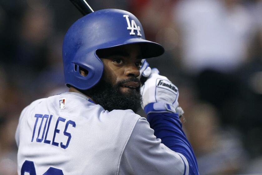Los Angeles Dodgers' Andrew Toles prepares to bat against the Arizona Diamondbacks during the sixth inning of a baseball game, Saturday, April 22, 2017, in Phoenix. The Diamondbacks defeated the Dodgers 11-5. (AP Photo/Ralph Freso)