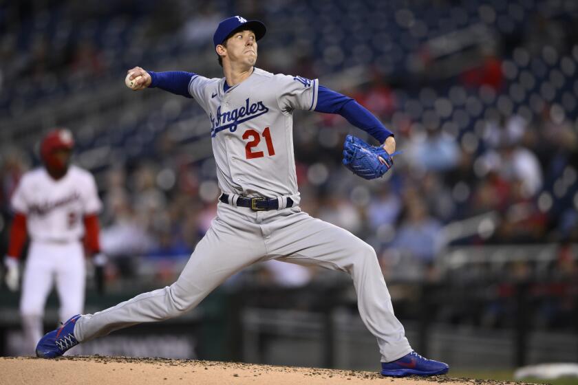 Los Angeles Dodgers starting pitcher Walker Buehler (21) in action during a baseball game against the Washington Nationals, Tuesday, May 24, 2022, in Washington. (AP Photo/Nick Wass)