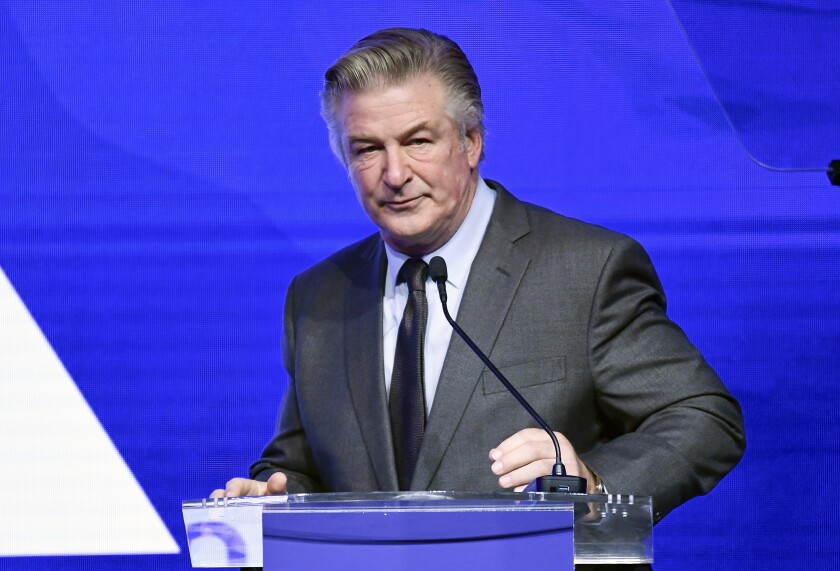 FILE - Alec Baldwin performs emcee duties at the Robert F. Kennedy Human Rights Ripple of Hope Award Gala at New York Hilton Midtown on Dec. 9, 2021, in New York. The widow and two sisters of a U.S. Marine killed in Afghanistan are suing Baldwin, alleging he exposed them to a flood of social media hatred and insults by claiming on Instagram that one sister was an "insurrectionist" for participating in the Jan. 6, 2021, demonstration in support of former President Donald Trump in Washington, D.C. The sister protested peacefully and legally and was not among those who stormed the U.S. Capitol that day, according to the lawsuit filed Monday, Jan. 17, 2022 in U.S. District Court in Cheyenne. (Photo by Evan Agostini/Invision/AP, File)