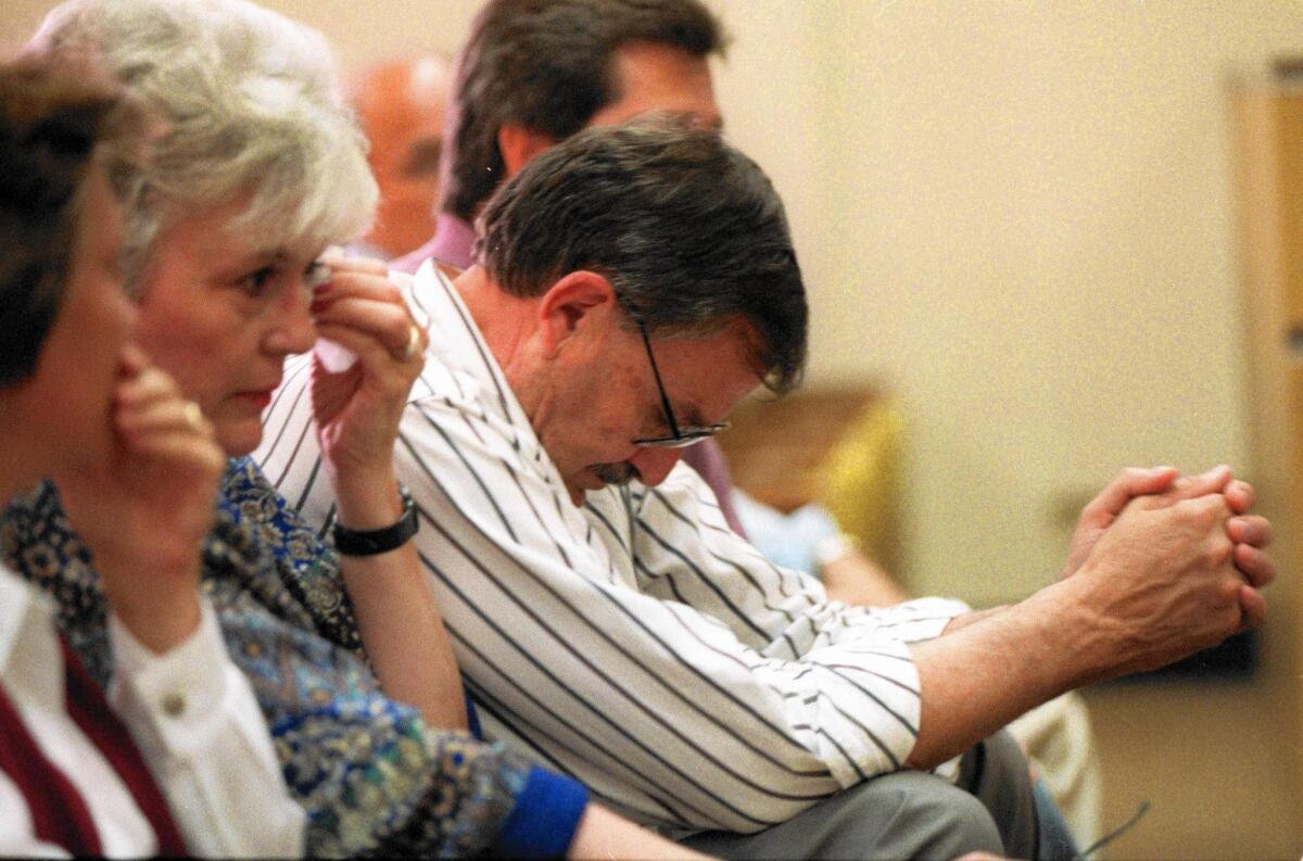 Ione Huber, second from left, and Dennis Huber, the parents of Denise Huber, react to the guilty verdict given to defendant John Famalaro in Orange County Superior Court in 1997.