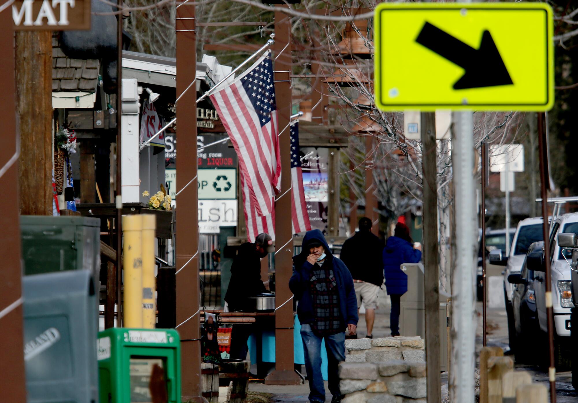 Shops are open but foot traffic is light in Tahoe City, where commerce is shut down.