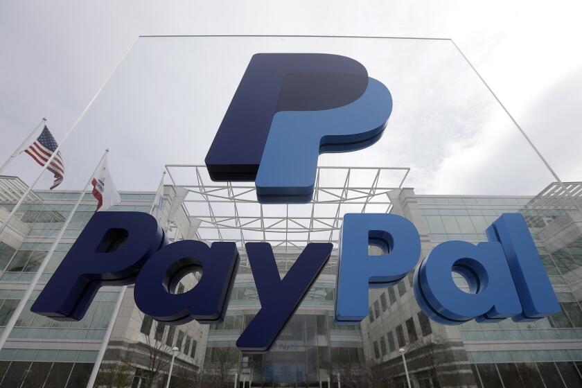 This March 10, 2015 photo shows signage outside PayPal's headquarters in San Jose, Calif. When eBay and PayPal split up on Friday, July 17, 2015, they'll face different challenges than they did as a combined company. (AP Photo/Jeff Chiu)