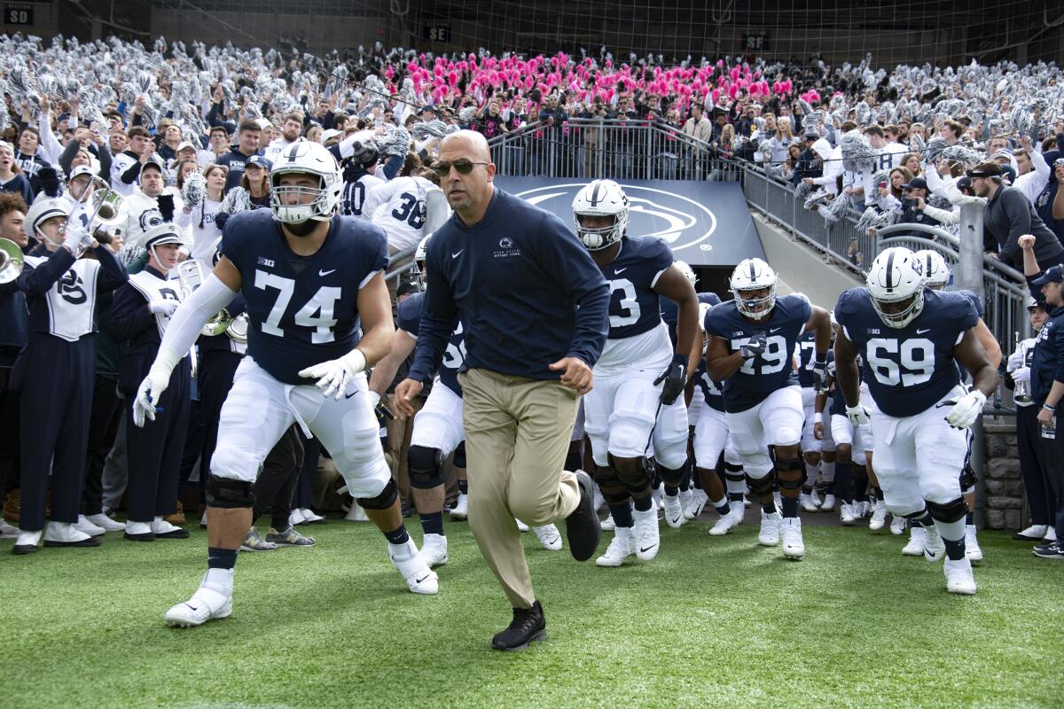 Penn State coach James Franklin leads his team onto the field before a game against Purdue in October 2019.
