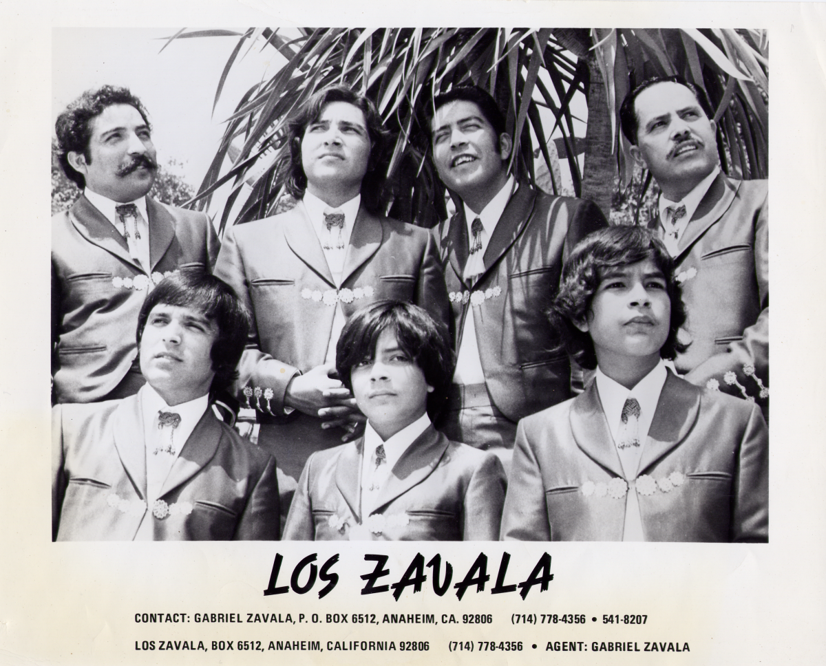 Gabriel B. Zavala stands next to his six brothers. 