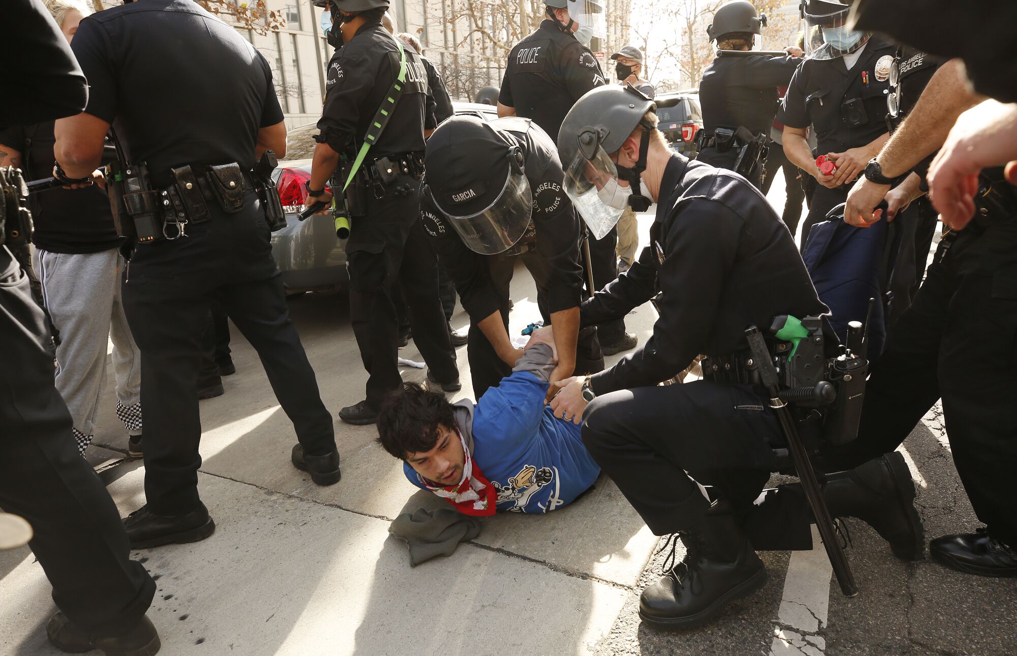 Counterprotesters are arrested after fighting with Trump supporters outside L.A. City Hall.
