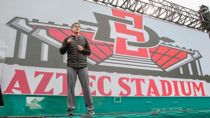 San Diego State athletic director John David Wicker speaks during a stadium-plan presentation last month. Wicker and athletic officials across the country are concerned about the impacts of the new tax bill.