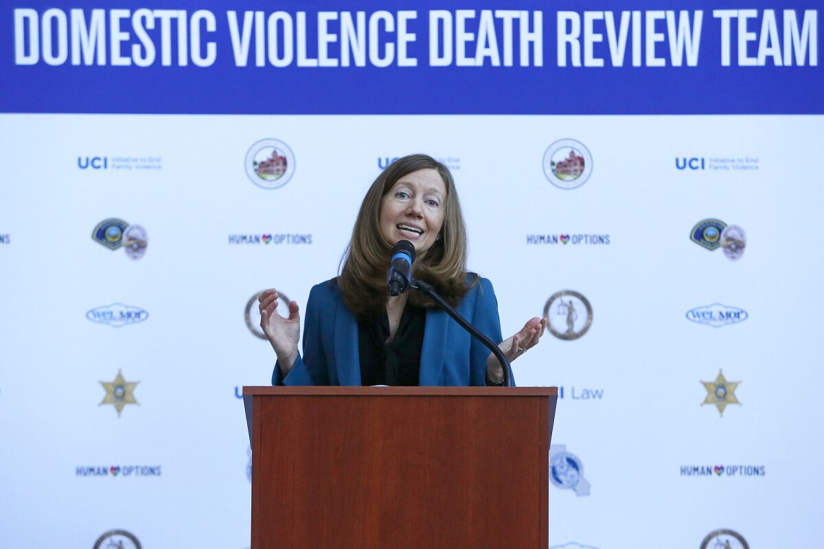 Jane Stoever, clinical law professor at UC Irvine, speaks during a press conference on domestic violence.