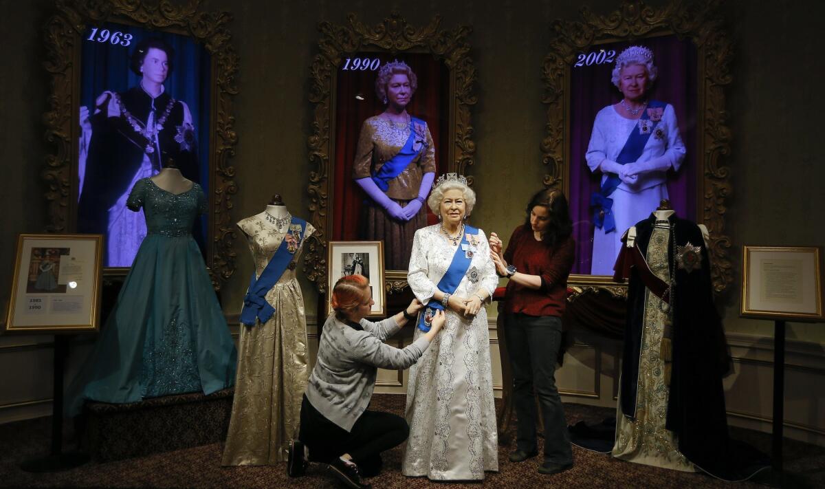 A wax work model of Britain's Queen Elizabeth II is prepared at Madame Tussauds in London, Monday, Sept. 7, 2015. The model is undergoing a commemorative redress. The Queen on Wednesday will become the longest ever reigning monarch in British history. (AP Photo/Kirsty Wigglesworth)